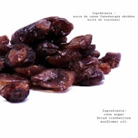 a pile of dried dates on a white background