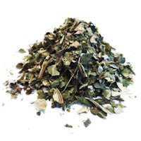 a pile of dried herbs on a white background