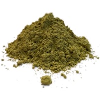 a pile of green powder on a white background