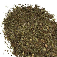 a pile of dried herbs on a white background