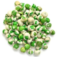 a pile of green and white peas on a white background