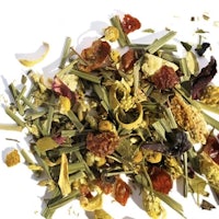 a pile of dried herbs and flowers on a white surface