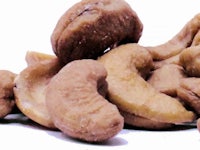 a pile of cashew nuts on a white background