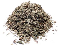 a pile of dried herbs on a white background
