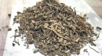a pile of dried herbs on top of a piece of paper