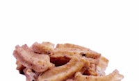 a pile of fried doughnuts on a white background