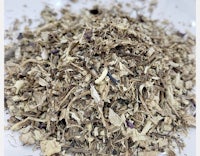 a pile of dried herbs on a white plate