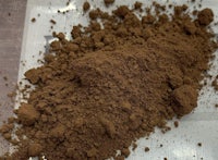 a pile of brown powder on a table