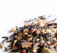 a pile of spices and herbs on a white background