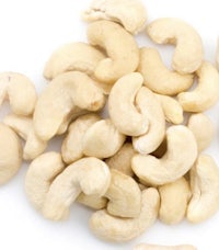 a pile of cashews on a white background