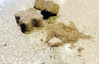 a pile of sand and dirt on a table