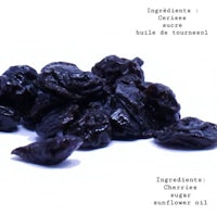 a bunch of dried grapes on a white background