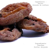 a pile of dried dates on a white background