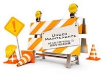 under maintenance signs and cones on a white background
