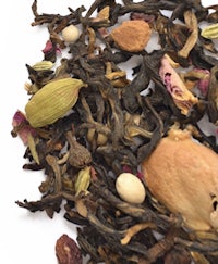 a pile of tea leaves and nuts on a white background