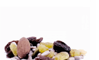 a pile of nuts and raisins on a white background