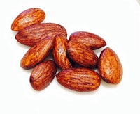 roasted almonds on a white background