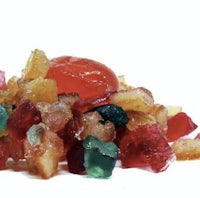 a pile of gummy candy on a white surface