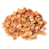a pile of dried fruit on a white background