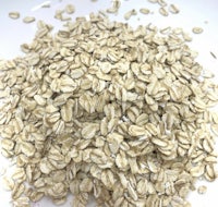 oats in a bowl on a white surface