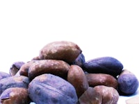 a pile of nuts on a white background