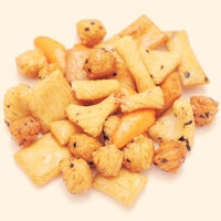 a pile of nuts and carrots on a white background