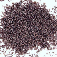 a pile of chocolate sprinkles on a white background