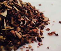 a pile of dried herbs on a white plate