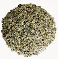 a pile of dried herbs on a white background