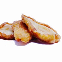 a pile of fried bananas on a white background