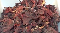 dried red hibiscus in a white bowl