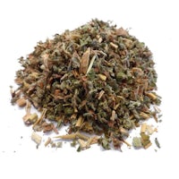 a pile of dried herbs on a white background