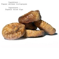 a pile of dried figs on a white background
