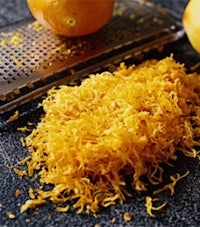 shredded orange peel on a cutting board