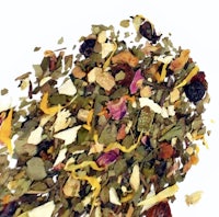 a pile of dried fruits and herbs on a white background