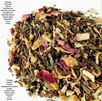 a pile of dried leaves and flowers on a white background