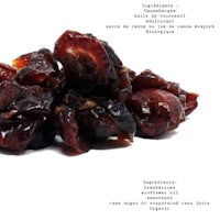 a pile of dried cranberries on a white background