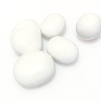 a group of white marbles on a white surface
