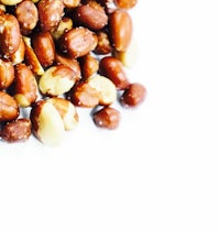a pile of nuts on a white background