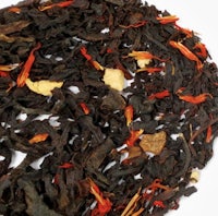 a pile of black tea with orange and red flowers