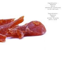 a piece of dried meat on a white background