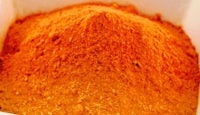 an orange powder is sitting in a box