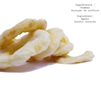 a pile of apple rings on a white background