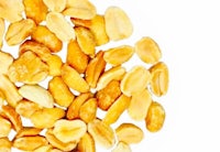 a pile of peanuts on a white background